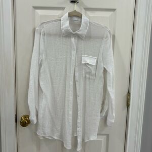 White collared shirt by Zoye Chen.